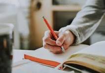 Writing in notebook